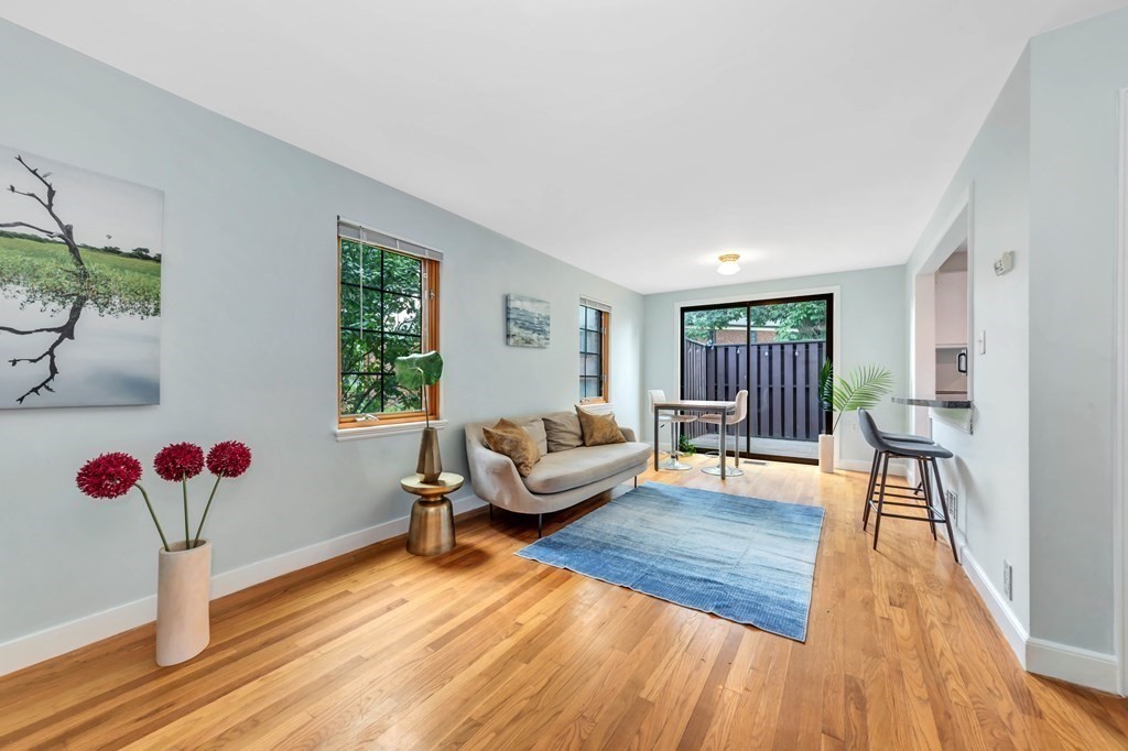 18 Pierce Road, Unit 18 Watertown, MA 02472 - Photo 2 of 38 a living room with furniture and a wooden floor