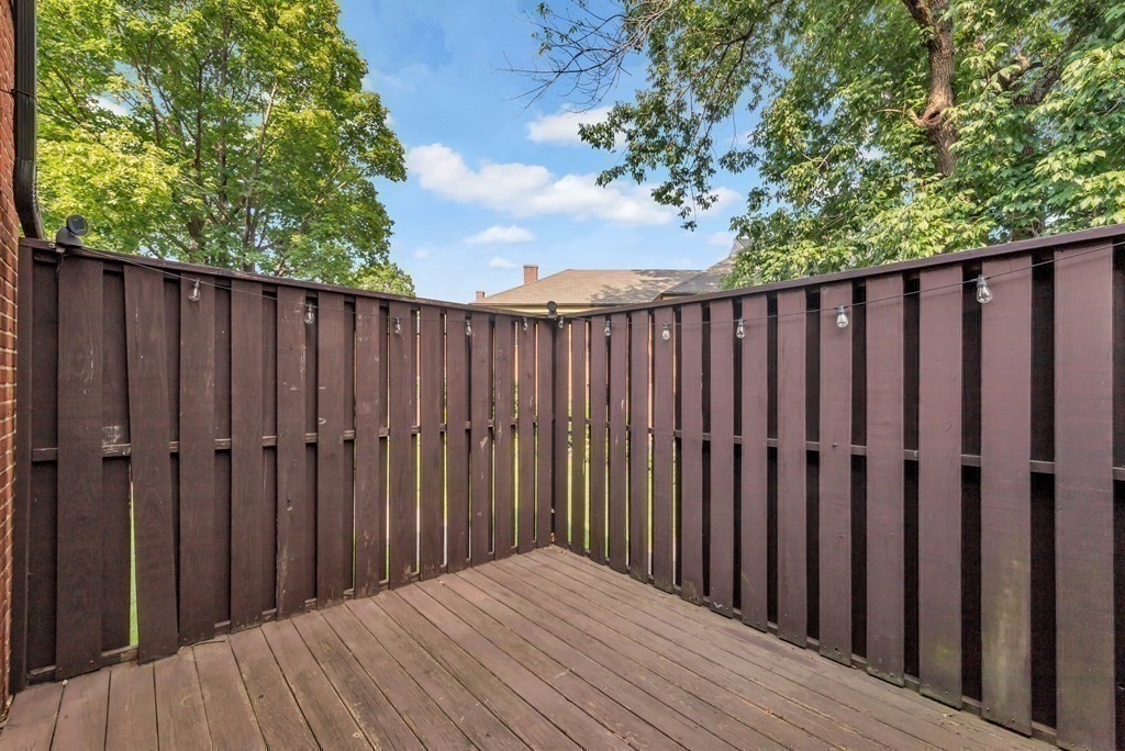 18 Pierce Road, Unit 18 Watertown, MA 02472 - Photo 21 of 38 a view of a wooden fence