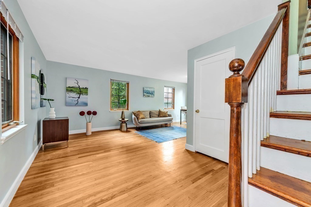 18 Pierce Road, Unit 18 Watertown, MA 02472 - Photo 26 of 38 a view of a bedroom with wooden floor and windows