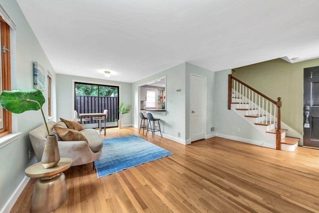 18 Pierce Road, Unit 18 Watertown, MA 02472 - Photo 29 of 38 a living room with furniture and a wooden floor