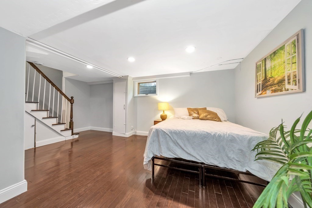 18 Pierce Road, Unit 18 Watertown, MA 02472 - Photo 33 of 38 a bedroom with a bed and a painting on the wall