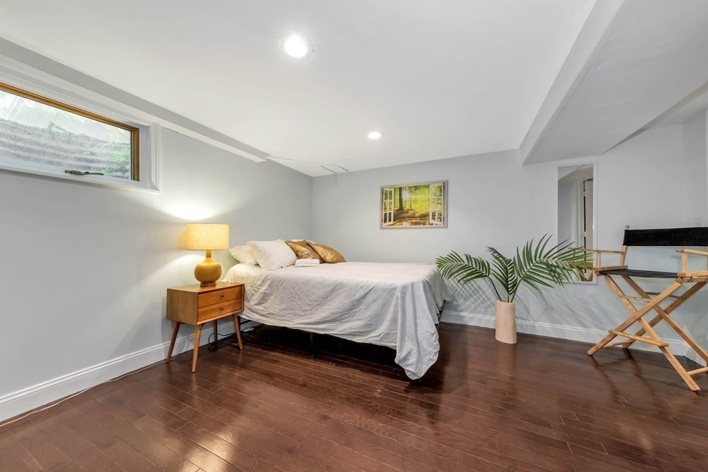 18 Pierce Road, Unit 18 Watertown, MA 02472 - Photo 35 of 38 a bedroom with a bed and a desk