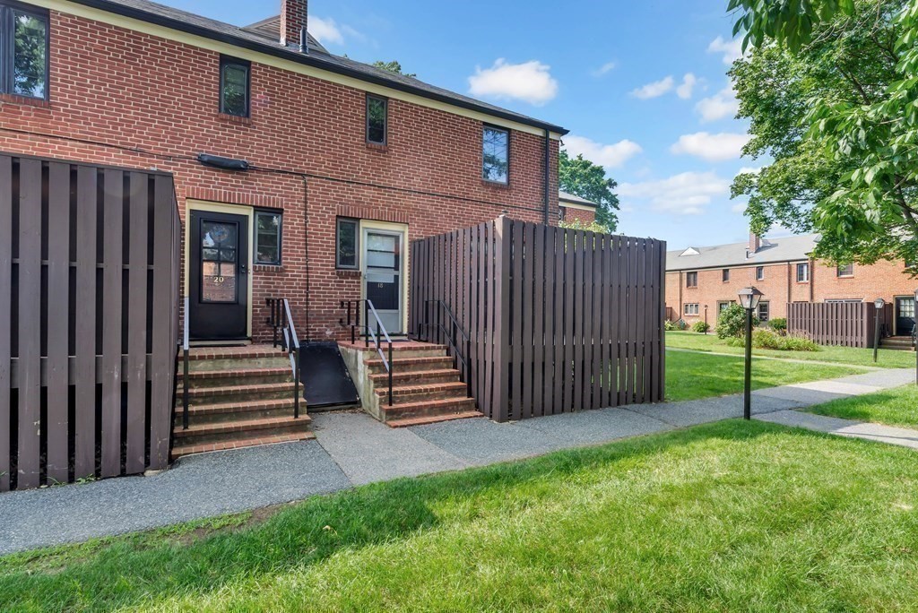 18 Pierce Road, Unit 18 Watertown, MA 02472 - Photo 38 of 38 a view of a house with backyard and wooden fence