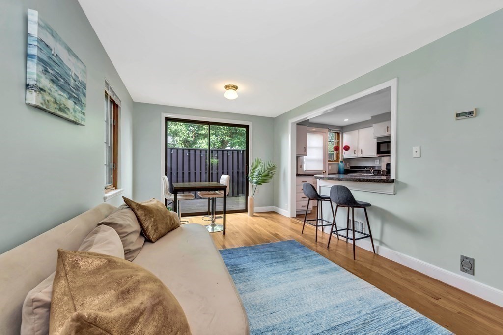 18 Pierce Road, Unit 18 Watertown, MA 02472 - Photo 7 of 38 a living room with furniture and a wooden floor