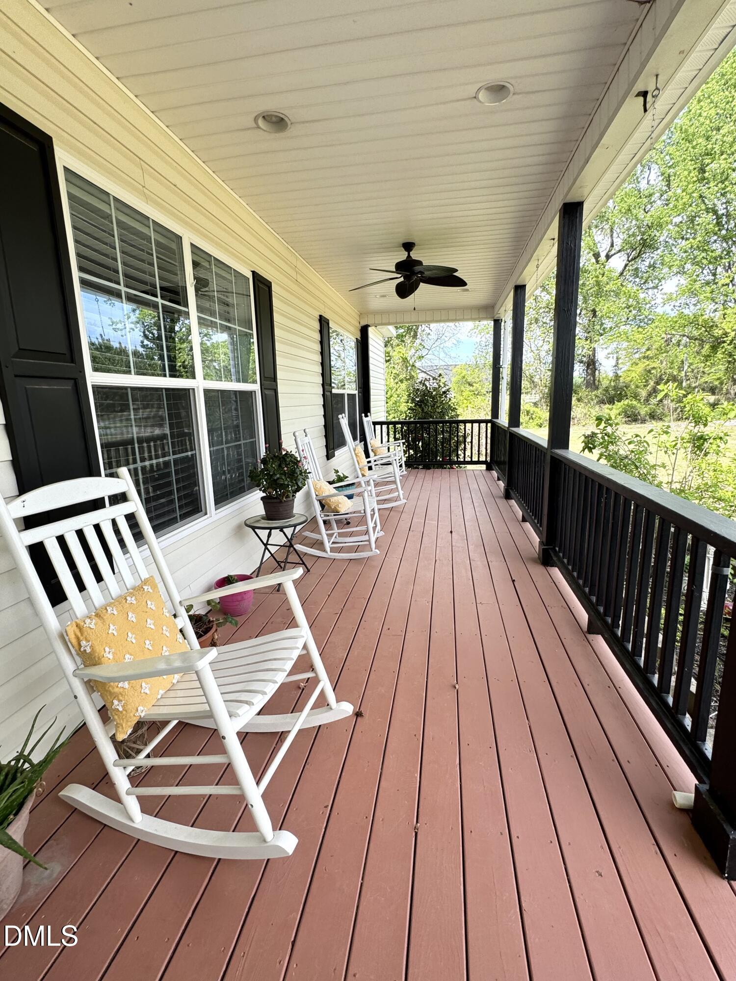 640 Tart Town Road Dunn, NC 28334 - Photo 2 of 71 a view of balcony with wooden floor and furniture