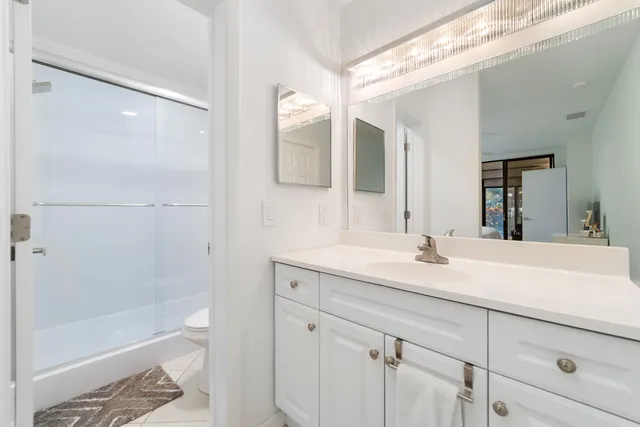 a bath room with a sink and a mirror
