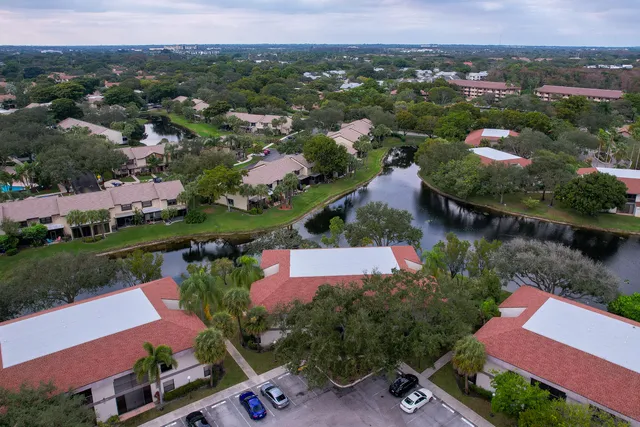an aerial view of residential houses with outdoor space and river