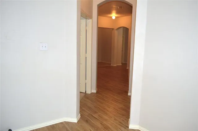 a view of a bathroom from a hallway