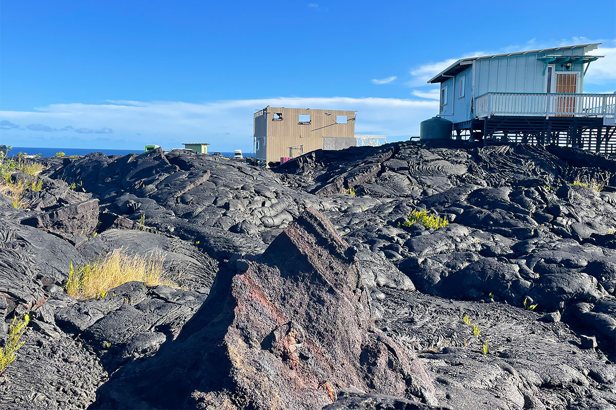 67 A Chain Of Craters Road Pahoa, HI 96778 - Photo 13 of 16 a aerial view of a house with swimming pool and outdoor seating
