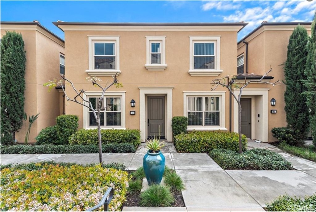 63 Fairymoss Irvine, CA 92620 - Photo 1 of 1 a front view of a house with garden