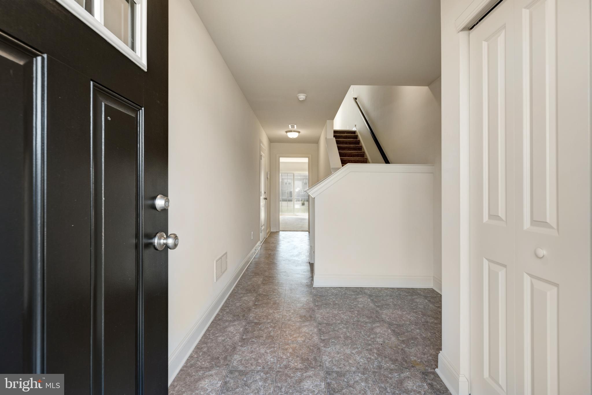 460 Rederick Lane Middletown, DE 19709 - Photo 2 of 12 a hallway with sliding door and entryway