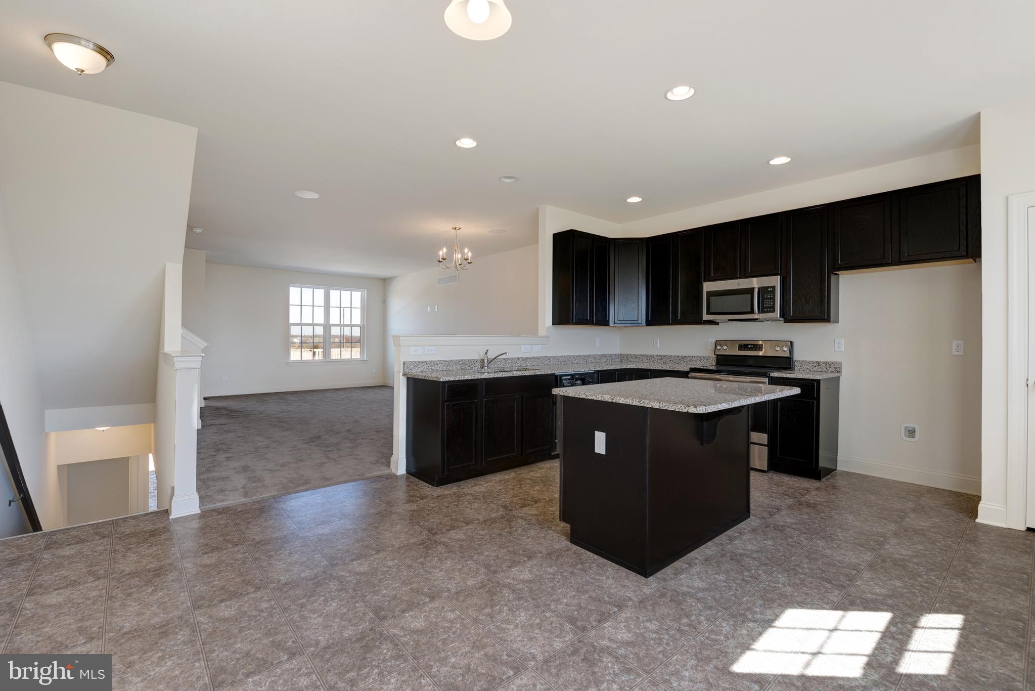 460 Rederick Lane Middletown, DE 19709 - Photo 4 of 12 a kitchen with stainless steel appliances granite countertop a sink a stove a refrigerator a center island and a window