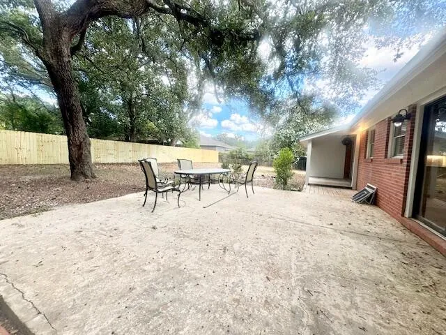 a view of a backyard with a patio