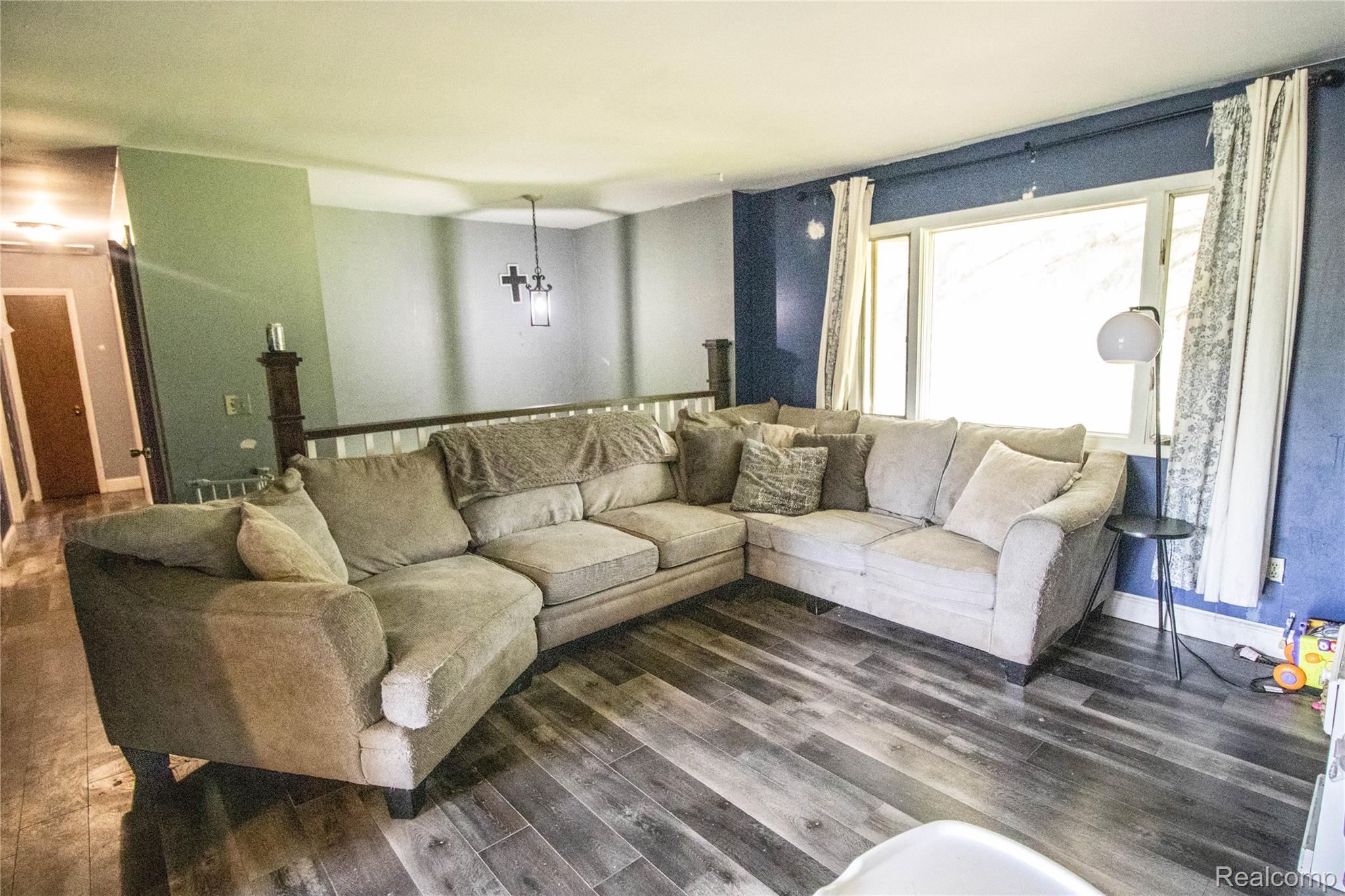 10340 Farrand Road Montrose, MI 48457 - Photo 12 of 33 Wood-finish flooring, large window, and a built-in railing structure