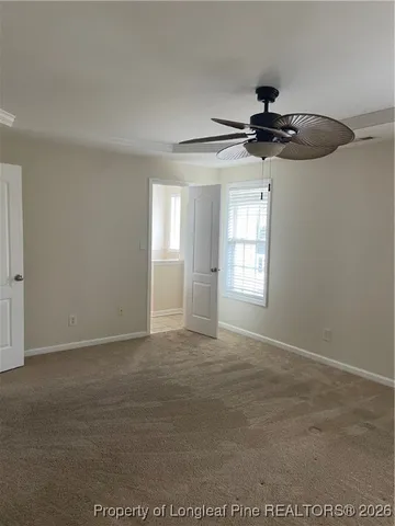 a spacious bathroom with a granite countertop sink a mirror and a vanity