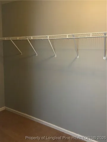 a toilet sitting in a bathroom next to a window