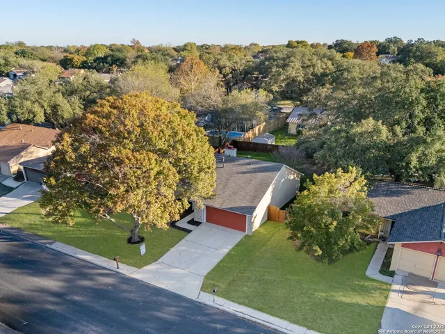 an aerial view of a house having yard