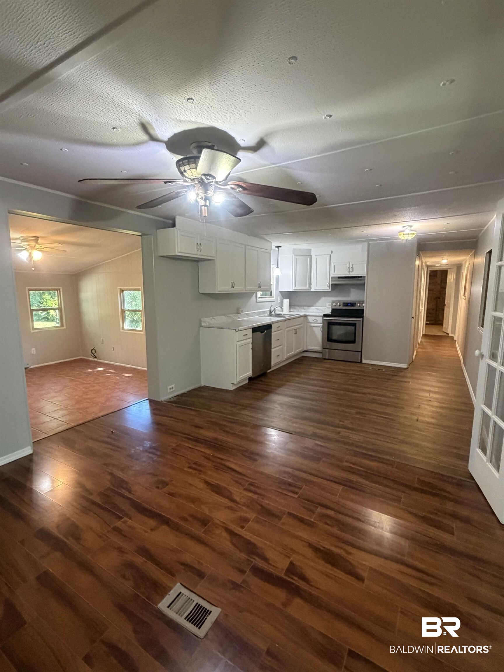 1354 Caney Loop Lillian, AL 36549 - Photo 8 of 45 Open-concept kitchen and living area featuring wood-finish flooring
