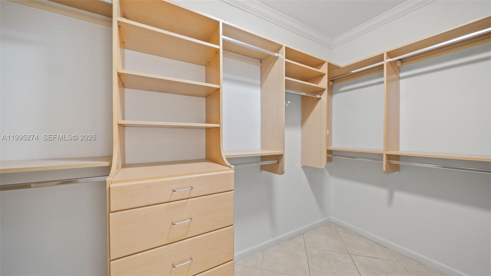 1907 Timberline Road Weston, FL 33327 - Photo 13 of 18 a view of walk in closet with empty racks