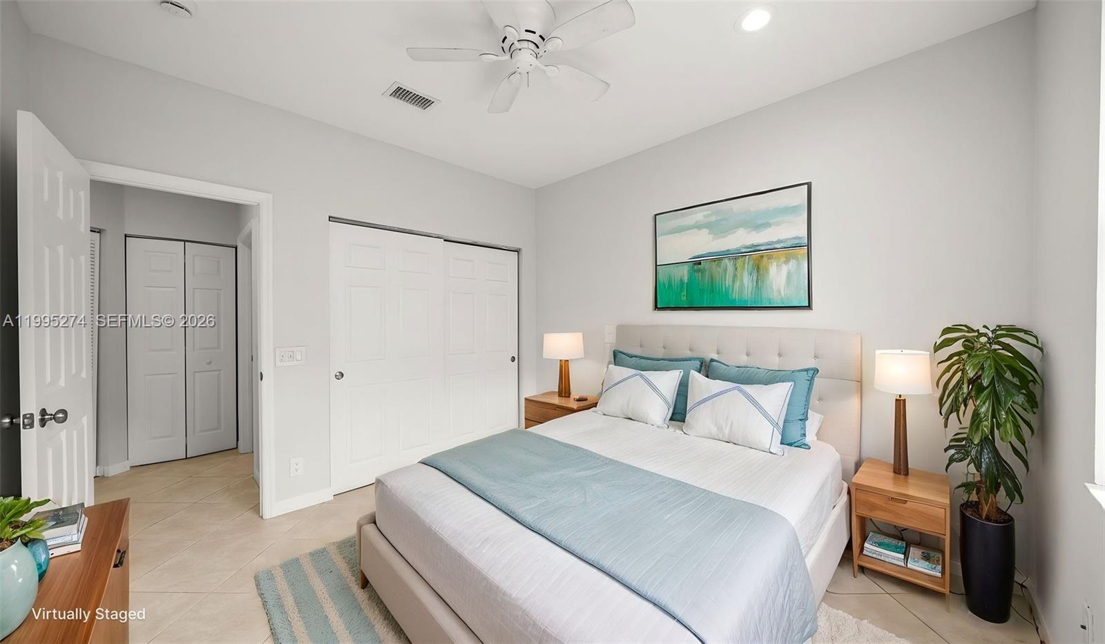 1907 Timberline Road Weston, FL 33327 - Photo 15 of 18 a bedroom with a bed and a chandelier