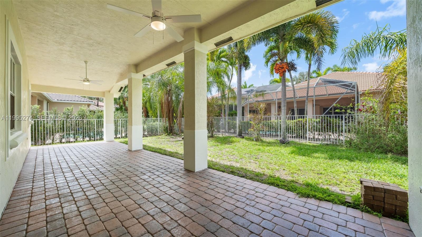 1907 Timberline Road Weston, FL 33327 - Photo 17 of 18 a view of backyard with garden and outdoor seating