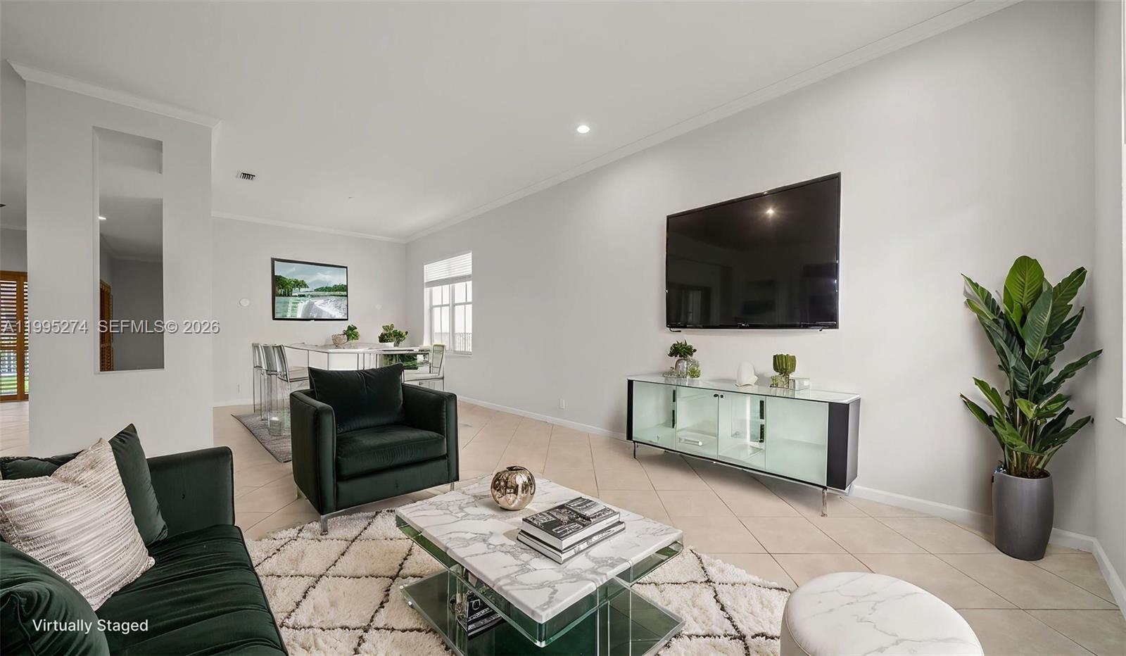 1907 Timberline Road Weston, FL 33327 - Photo 4 of 18 a living room with furniture and a flat screen tv