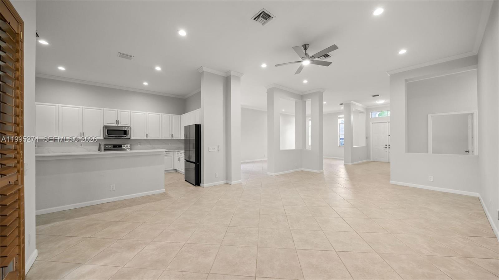 1907 Timberline Road Weston, FL 33327 - Photo 7 of 18 a view of a kitchen with refrigerator and a sink