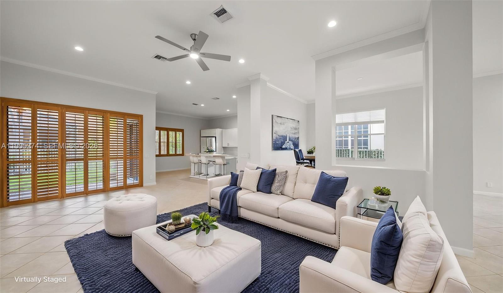 1907 Timberline Road Weston, FL 33327 - Photo 8 of 18 a living room with furniture and a wooden floor