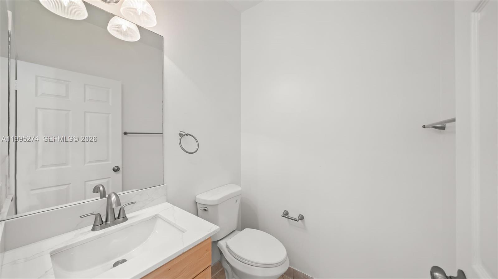 1907 Timberline Road Weston, FL 33327 - Photo 10 of 18 a bathroom with a sink a toilet and shower