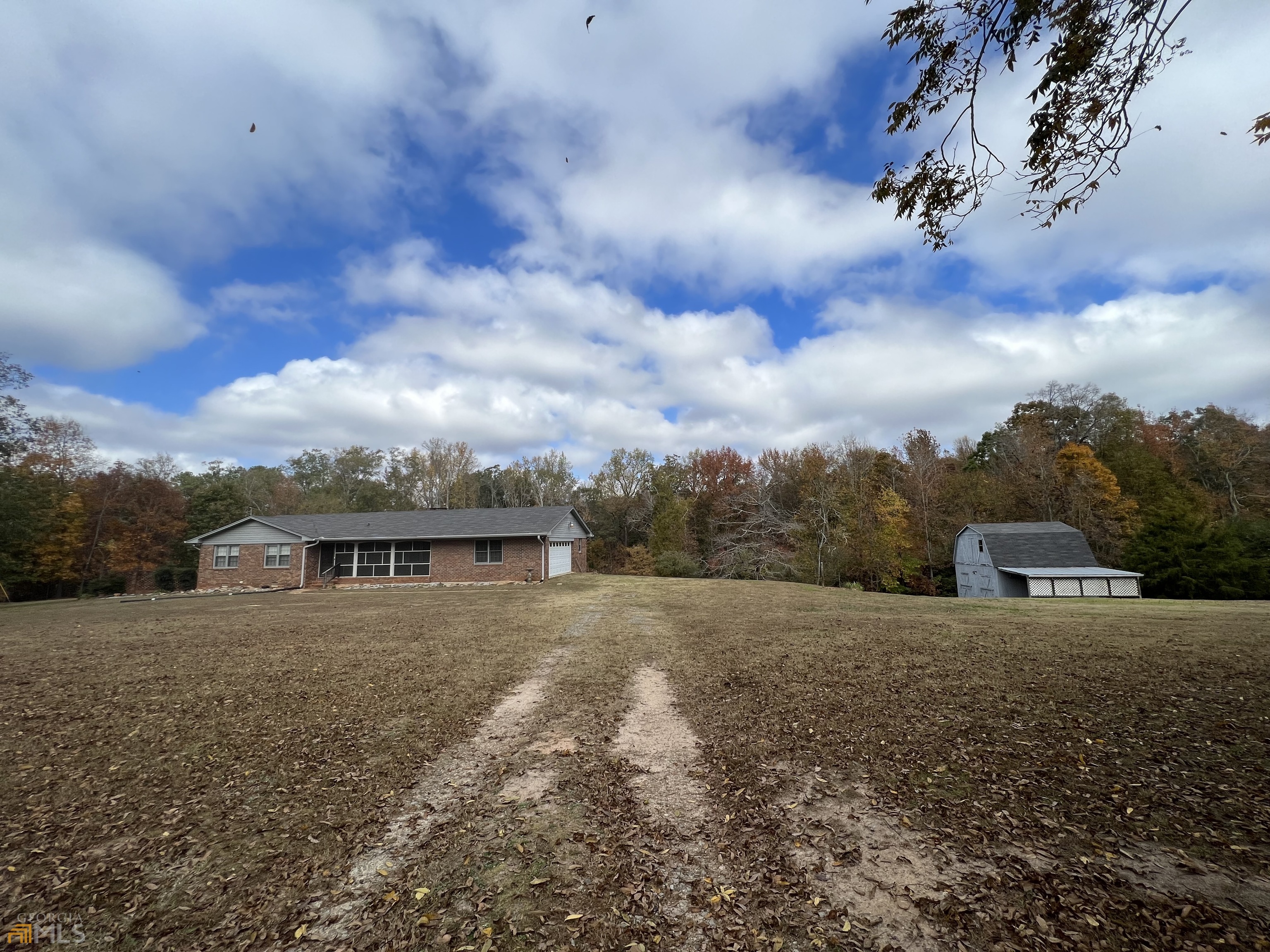 1925 Rehoboth Road Bowman, GA 30624 - Photo 1 of 1 a view of house with river and car parked