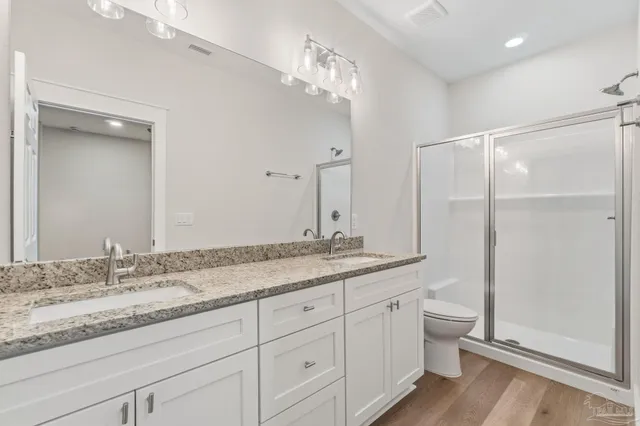 a bathroom with a granite countertop sink mirror and vanity