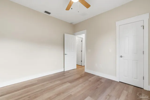 a bathroom with a granite countertop toilet a sink and a bathtub