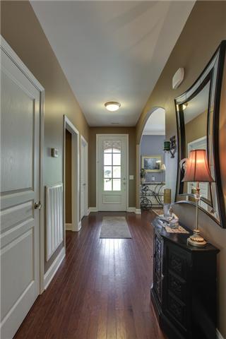 369 Truman Road West Franklin, TN 37064 - Photo 2 of 20 THE ENTRY FOYER FEATURES HARDWOODS AND ROOMY ENOUGH FOR A TABLE...THE OWNER HAS MADE GREAT USE OF THE AREA UNDER THE STAIRS BY CREATING A "SAFE AREA" THAT CAN BE ACCESSED THROUGH THE COAT CLOSET