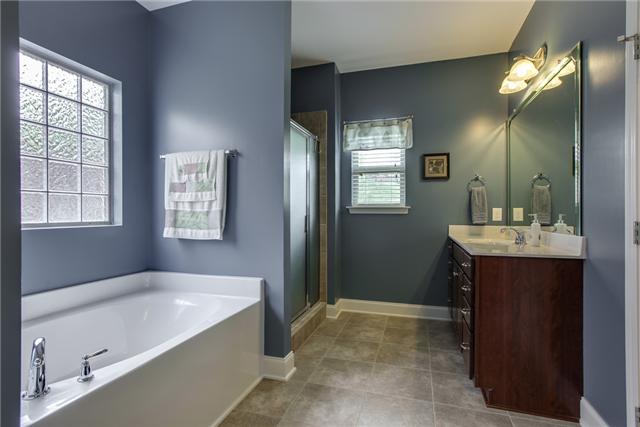 369 Truman Road West Franklin, TN 37064 - Photo 10 of 20 MASTER BATH HAS SEPARATE RAISED VANITIES W/BEVELED MIRRORS, LVT TILE FLOORS, SEPARATE TUB & SHOWER