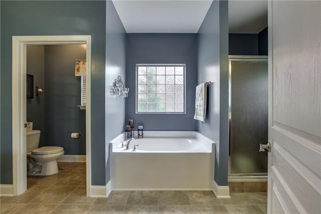 369 Truman Road West Franklin, TN 37064 - Photo 11 of 20 RELAX A WHILE IN THIS TUB WITH GLASS BLOCK WINDOW OR THE TILED SHOWER