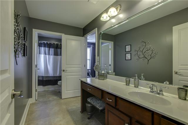 369 Truman Road West Franklin, TN 37064 - Photo 13 of 20 THE JACK-N-JILL BATH FEATURES AN EXTRA LARGE VANITY WITH SITTING AREA, LVT TILE FLOORS AND COMBO TUB/SHOWER