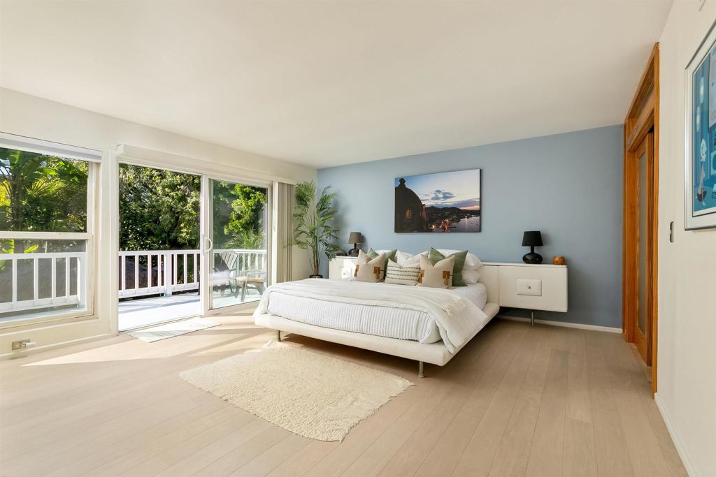 2252 Soledad Rancho Road San Diego, CA 92109 - Photo 15 of 39 a bed room with a bed and a large window