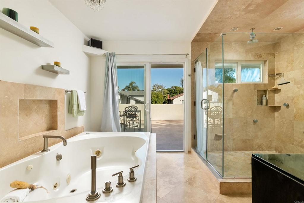2252 Soledad Rancho Road San Diego, CA 92109 - Photo 17 of 39 a bathroom with a tub and a shower