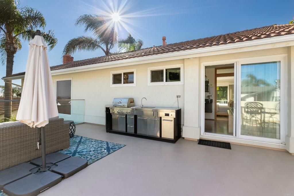 2252 Soledad Rancho Road San Diego, CA 92109 - Photo 29 of 39 a view of a house with backyard and porch