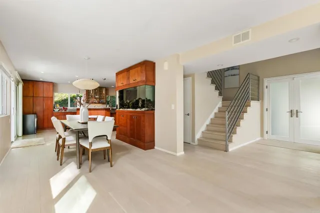 a view of a house with swimming pool and a chairs