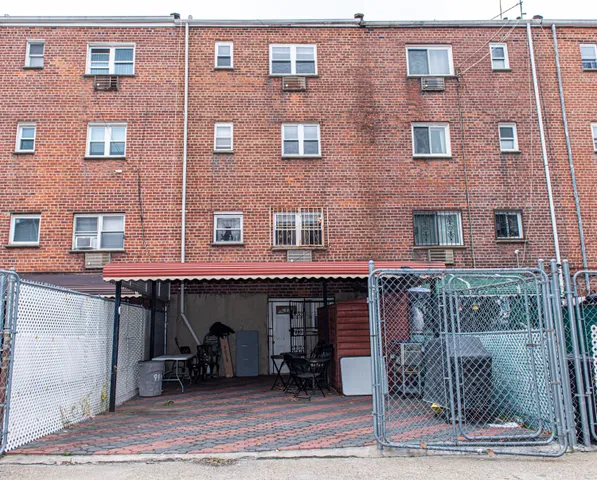 a front view of a building with many windows