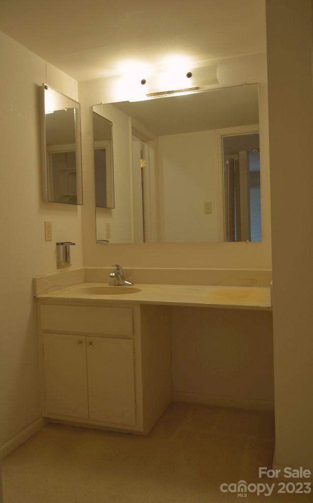 3508 Colony Road, Unit D Charlotte, NC 28211 - Photo 17 of 24 a bathroom with a sink and a mirror