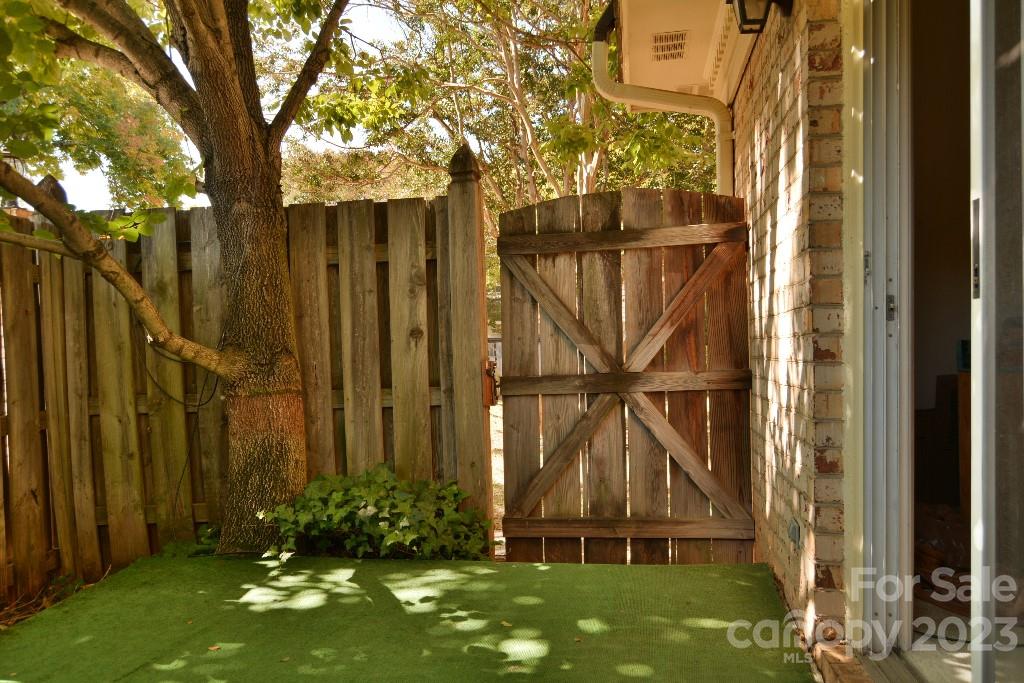 3508 Colony Road, Unit D Charlotte, NC 28211 - Photo 23 of 24 a view of a small yard and large trees