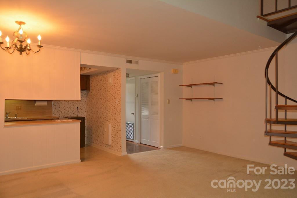 3508 Colony Road, Unit D Charlotte, NC 28211 - Photo 5 of 24 a view of a kitchen with a dishwasher and cabinets