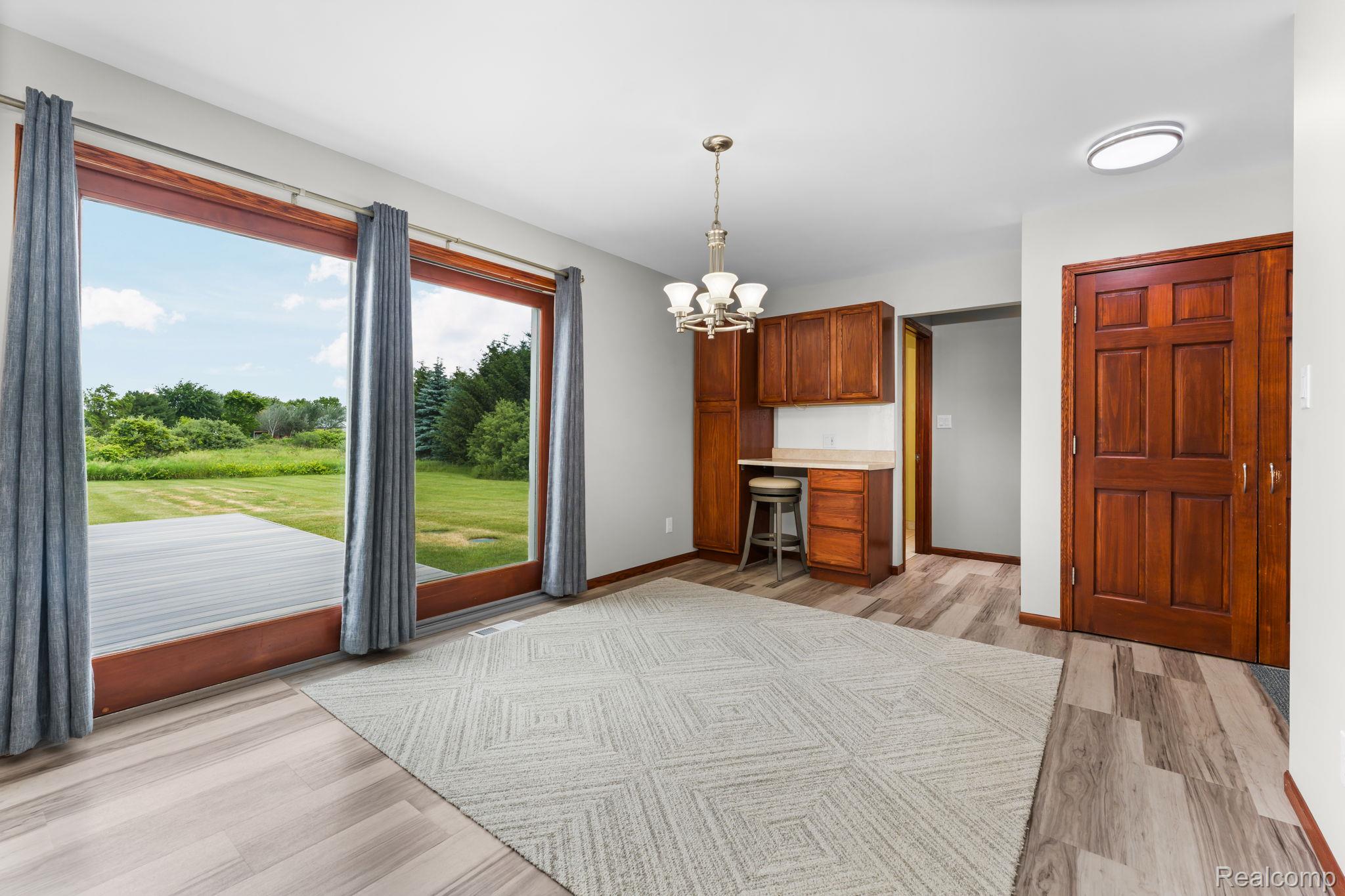2381 Burke Road Fowlerville, MI 48836 - Photo 10 of 31 Spacious dining area with door wall and extra pantry.