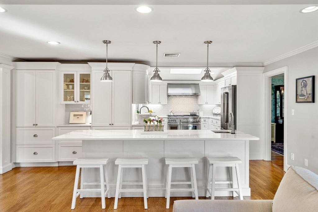 40 Morton Street Andover, MA 01810 - Photo 12 of 32 a kitchen with cabinets and window