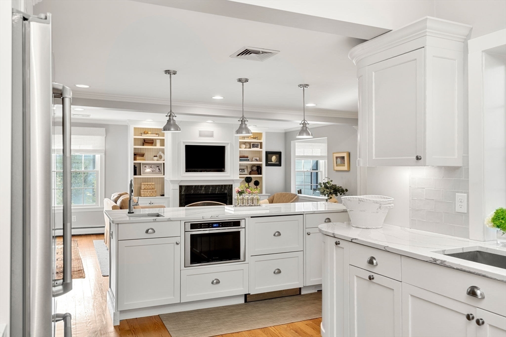 40 Morton Street Andover, MA 01810 - Photo 14 of 32 a kitchen with appliances a sink and cabinets