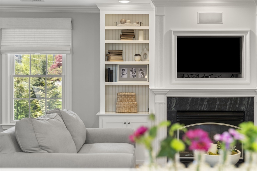 40 Morton Street Andover, MA 01810 - Photo 15 of 32 a living room with furniture and a flat screen tv