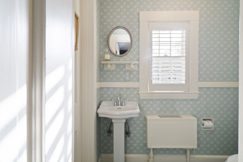 40 Morton Street Andover, MA 01810 - Photo 19 of 32 a bathroom with a sink a mirror and a window