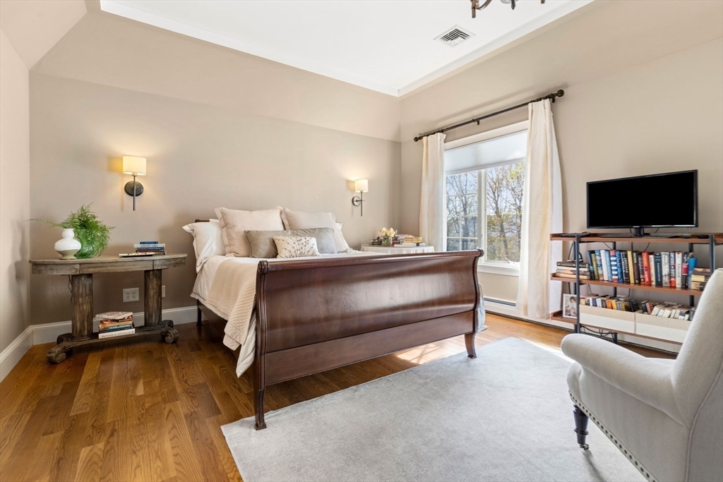 40 Morton Street Andover, MA 01810 - Photo 20 of 32 a bedroom with furniture and a flat screen tv